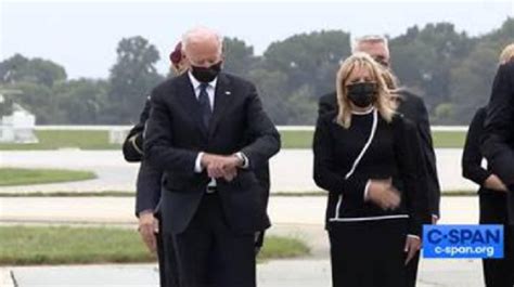 biden looking at watch fake|Fact Check: Live videos of Biden taking presidential oath .